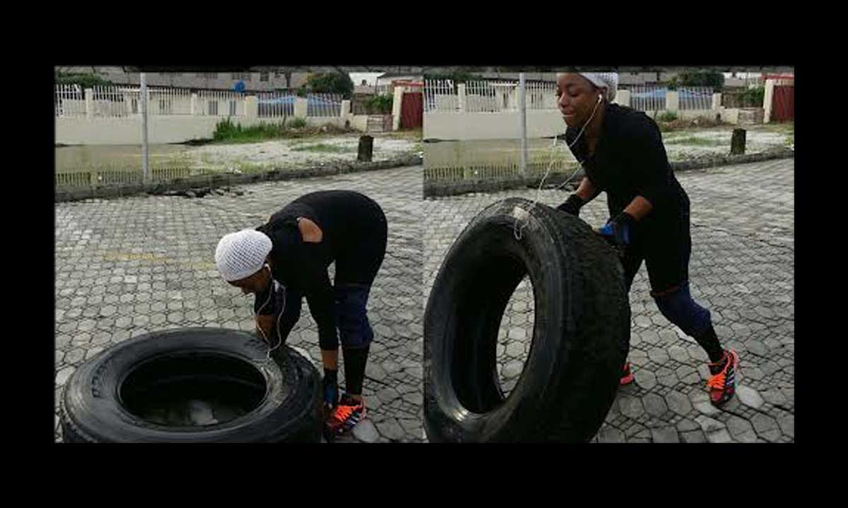 Bimbo Akintola flips tire for body building