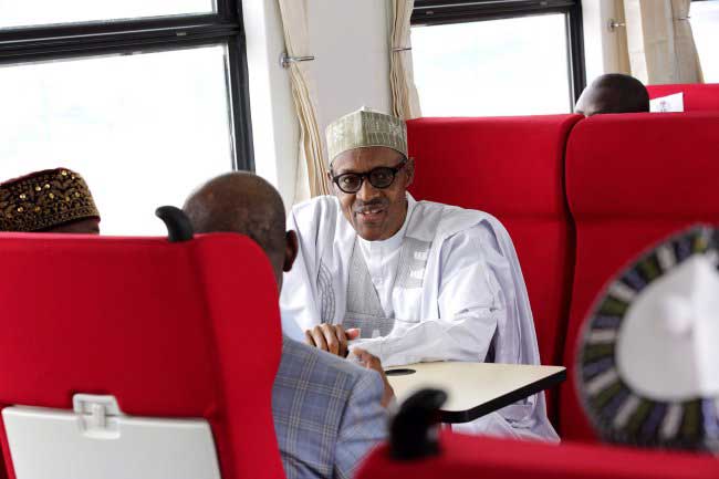 Photos: Buhari, Amaechi Rides in New Abuja Train