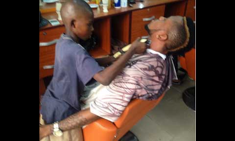 Amazing! Meet 10 Year Old Boy Who Earn 5000 Naira A Day Through Barbing