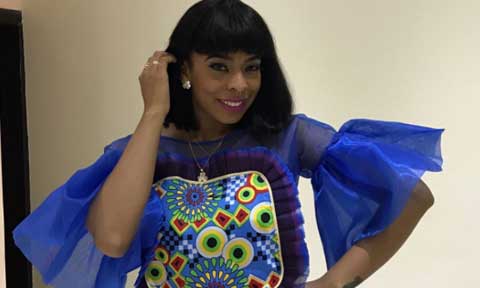 Photos: TBoss Looks Incredibly Svelte In Candy Crop Top And High Waist Pants