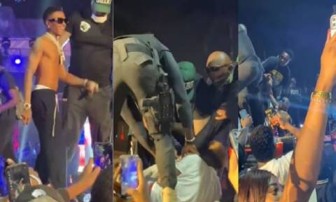 Wizkid Falls On Stage As Fan Drags Leg In Abuja Concert